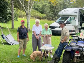 A lovely bunch of ladies camping having pikelets with Simon