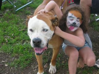 Face painted like her dog